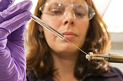 Goddard scientist Jennifer Eigenbrode injecting a chemical into a rock sample