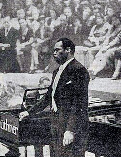 Robeson performs at Birmingham Town Hall, England, on March 7, 1939, in aid of a local charity, the Birmingham Mail Christmas Tree Fund.[179] The advertised pianist was Lawrence Brown.[180]