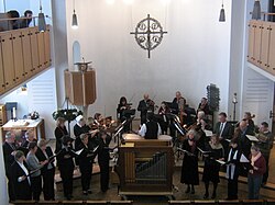 Choir in front of the orchestra