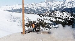Forest Service team uses a 106 mm recoilless rifle for avalanche control at Mammoth Mountain in the Inyo National Forest in California. Note the Minarets in background.