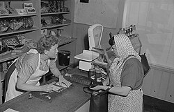 A typical "Tante Emma" working in a shop, 1953