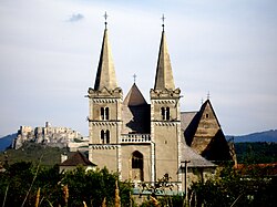 Two main symbols of the medieval Western civilization on one picture: the gothic St. Martin's cathedral in Spišské Podhradie (Slovakia) and the Spiš Castle behind the cathedral
