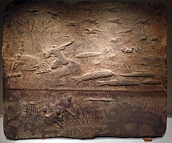 Han dynasty tomb brick depicting a fishing and hunting scene