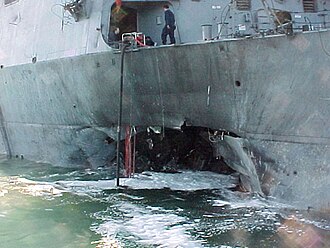 The side of USS Cole (DDG-67) after she was bombed in 2000