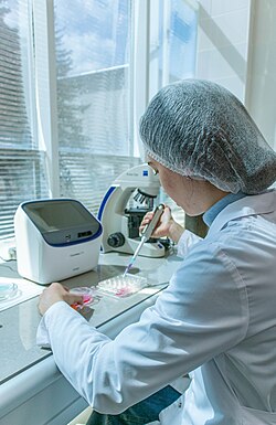 A biologist conducting research in a biotechnology laboratory