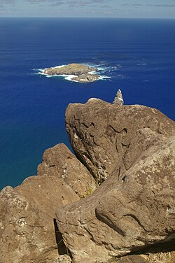 Petroglyphs on rocks at Orongo. Make-make at base and two birdmen higher up.