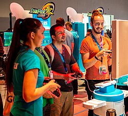 Attendees at Gamescom 2015 playing a video game