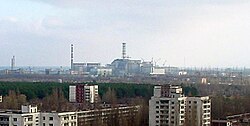 Pripyat with the Chernobyl Nuclear Power Plant in the distance