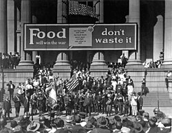 A banner reading, "Food will win the war—don't waste it", in front of city hall in New Orleans in October 1918