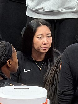 Nakase speaks to Valkyries players during a time out at a game against the Indiana Fever in Indianapolis, Indiana in 2026.