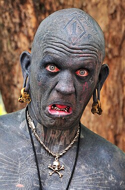 As of 2006, Lucky Diamond Rich holds the Guinness World Record of "The world's most tattooed person", with tattoos covering his entire body.