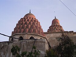 The twin muqarnas domes of the Nur al-Din Madrasa.[80][81]