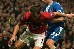 Owen defended by Lucas Neill of Everton