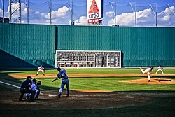 Fenway Park, home of the Boston Red Sox. The Green Monster is visible beyond the playing field.