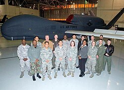 AFOTEC Detachment 5 personnel in front of a RQ-4 Global Hawk