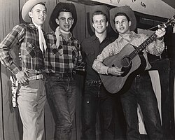 Texan folk costume comprising cowboy hats, jeans and checked western shirts (c. 1950)
