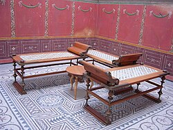 Reconstructed Roman triclinium or dining room, with three klinai or couches