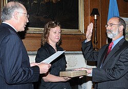 Secretary of the Interior Ken Salazar swears in Michael Bromwich as the new director of the Bureau on June 21, 2010. Betsy Hildebrandt, Department of Interior Communications Director holds the Bible.