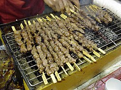 Chuan-style lamb kebab sticks sold by a street vendor