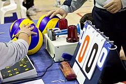 A scorer's table shown just before a volleyball game