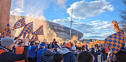 Fans marching to TQL Stadium before a 2024 match