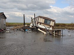 Tipped and flooded home, Terrebonne Parish, Louisiana.