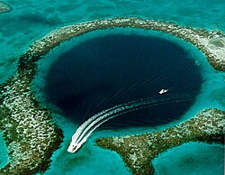 The Great Blue Hole off the coast of Belize is a prime ecotourism destination. It is a UNESCO World Heritage Site