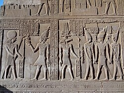 Relief from the temple of Kom Ombo depicting Ptolemy VIII receiving the sed symbol from Horus[54]