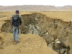 Gully in unconsolidated Dead Sea sediments exposed by recession of water levels. It was excavated by floods from the Judean Mountains in less than a year.