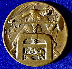 The devil operating a screw press against a workman, Nazi propaganda medal