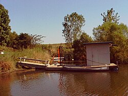 Wood-heated floating sauna on Iowa farm pond