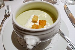 Chilled leek and potato soup garnished with croutons