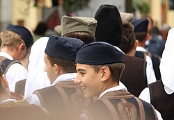 Boys wearing the šajkača, a traditional cap.