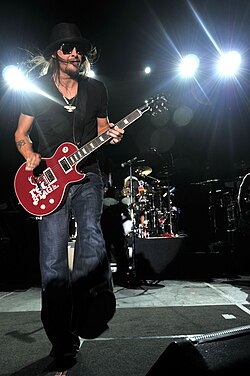 The music of Kid Rock was cited as a bridge between hip hop and rap rock.[12]