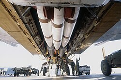 B-52H bomb bay: AGM-69 SRAM missiles (front, white) and B28 nuclear bombs (background, gray), as a downloading takes place during Exercise GLOBAL SHIELD '84