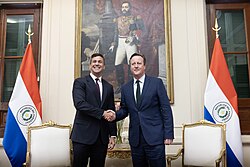 Santiago Peña and David Cameron in front of a portrait of Solano López, February 2024