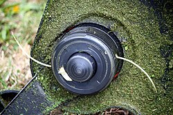 A bump feed style string trimmer head