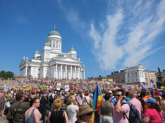 Pride events are held annually around the world for sexual minorities. In picture, people gathering at the Senate Square, Helsinki, right before the 2011 Helsinki Pride parade started.