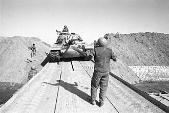 An Israeli M60/Magach tank crosses the Suez Canal, 1973