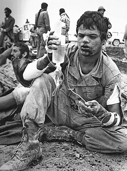 A wounded Iranian soldier holding an IV bag