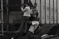 Migrant family freighthopping in southern Mexico from Central America