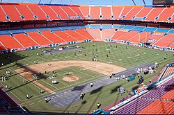 Dolphin Stadium shown prepping for a Miami Dolphins game with Florida Marlins baseball gridlines visible on the field in August 2007