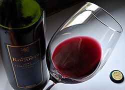 Tilting the glass and judging a wine's color against a white background is often one of the first steps in tasting a wine.[83]