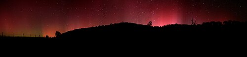 Aurora australis appearing in the night sky of Swifts Creek, 100 km (62 mi) north of Lakes Entrance, Victoria, Australia
