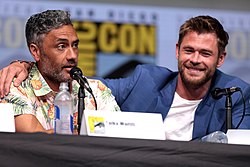 Waititi with Chris Hemsworth speaking at the 2017 San Diego Comic-Con