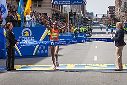 Rita Jeptoo crossing the finishing line