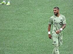 Denis Bouanga wearing the 2023 smokescreen kit with the new BMO Bank sponsor which replaced the FLEX sponsor in 2024.