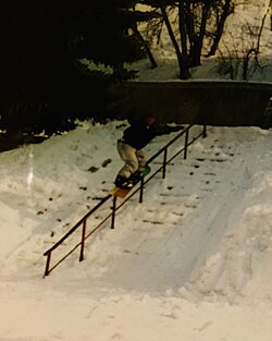 Freestyle snowboarder Matty Shaffer performs a 50-50 on a handrail while filming for a movie in Utah.