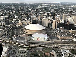 You see the Superdome and Smoothie King Center along with the surrounding area of Downtown New Orleans.