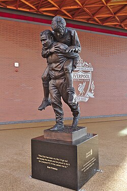 Statue of Bob Paisley carrying the injured former Liverpool captain Emlyn Hughes outside Anfield. Paisley remains the most successful manager in the club's history.